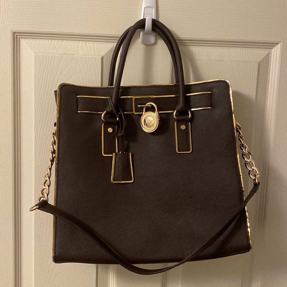 Worn a few times kept in closet. Rough size is 17.5"W X 12.75"H X 5.5"D